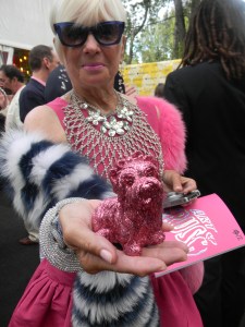 Shari Applebaum in Valentino and 'adapted' pet pink puppy purse by artist Jeff Koons.