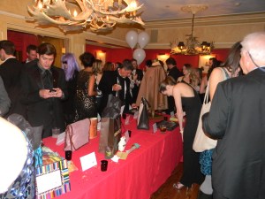 Guests bidding at the benefit at the Caribou on Saturday night
